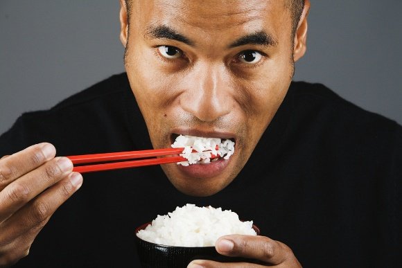 Asian Man Eating Rice 580 px