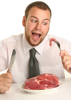 Man Eating Raw Steak