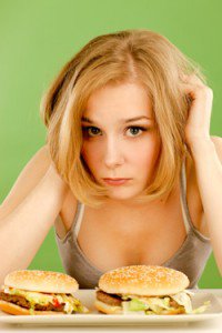 Young Woman Feels Bad About Eating Junk Food